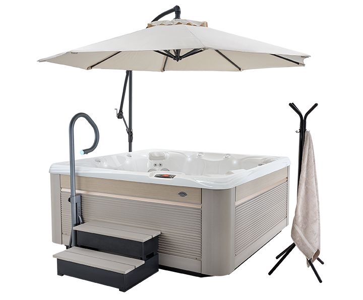 paradise reunion hot tub spa with parchment colored siding and spa side umbrella accessories including towel rack and handrail