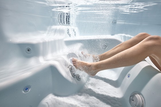 An image of lady enjoying the besthot tub foot massage jets