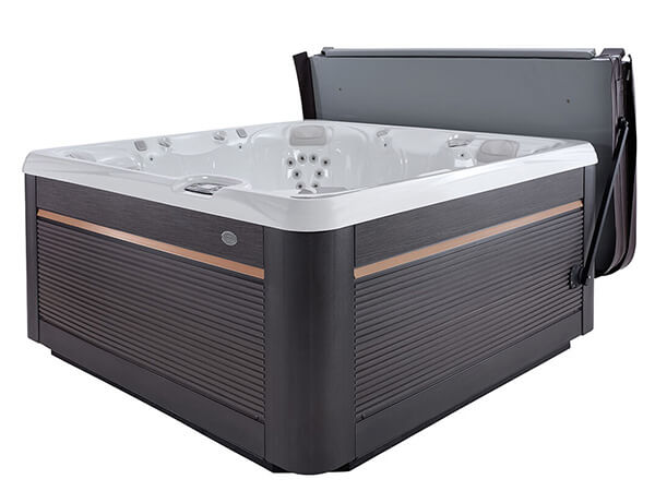 A luxurious Utopia Series Geneva spa with a sleek, modern design. The spa features a dark cabinet with a wood-grain finish and a white shell.