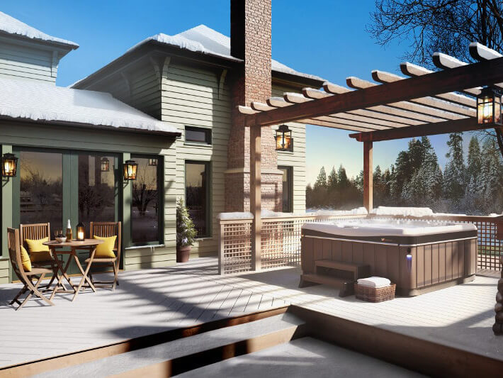 Luxurious Caldera Spa hot tub with a wooden pergola and outdoor seating area.